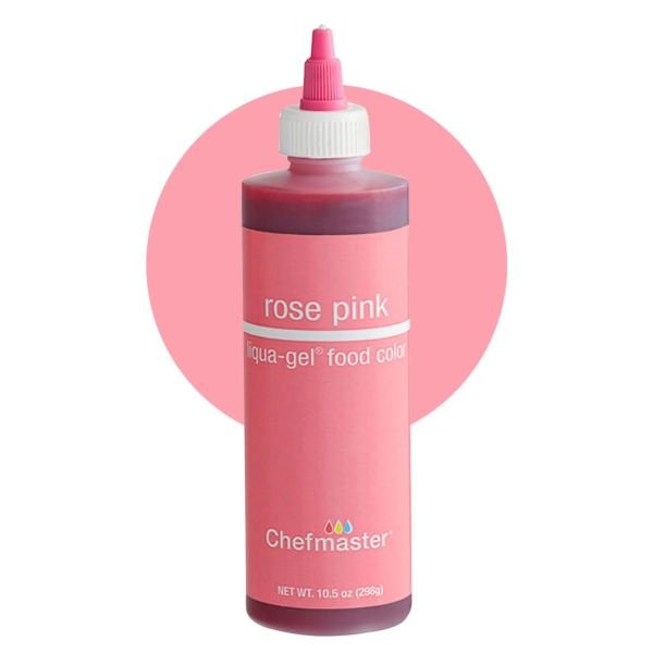 The image features a bottle of Chefmaster liquid food color labeled "rose pink." The bottle is predominantly a pastel pink with a white lid and a pink dispensing nozzle. The label indicates that the product is 10.5 ounces (298 grams) and is categorized as a liqua-gel food color. The background is a soft pink circle, enhancing the overall aesthetic of the product.