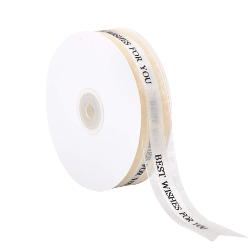 A roll of white ribbon is displayed, measuring 2.5 cm in width and 5 yards in length. The ribbon features the text "BEST WISHES FOR YOU" printed along its length in a decorative font. The roll is positioned so that part of the ribbon is unraveling, showcasing the printed message.