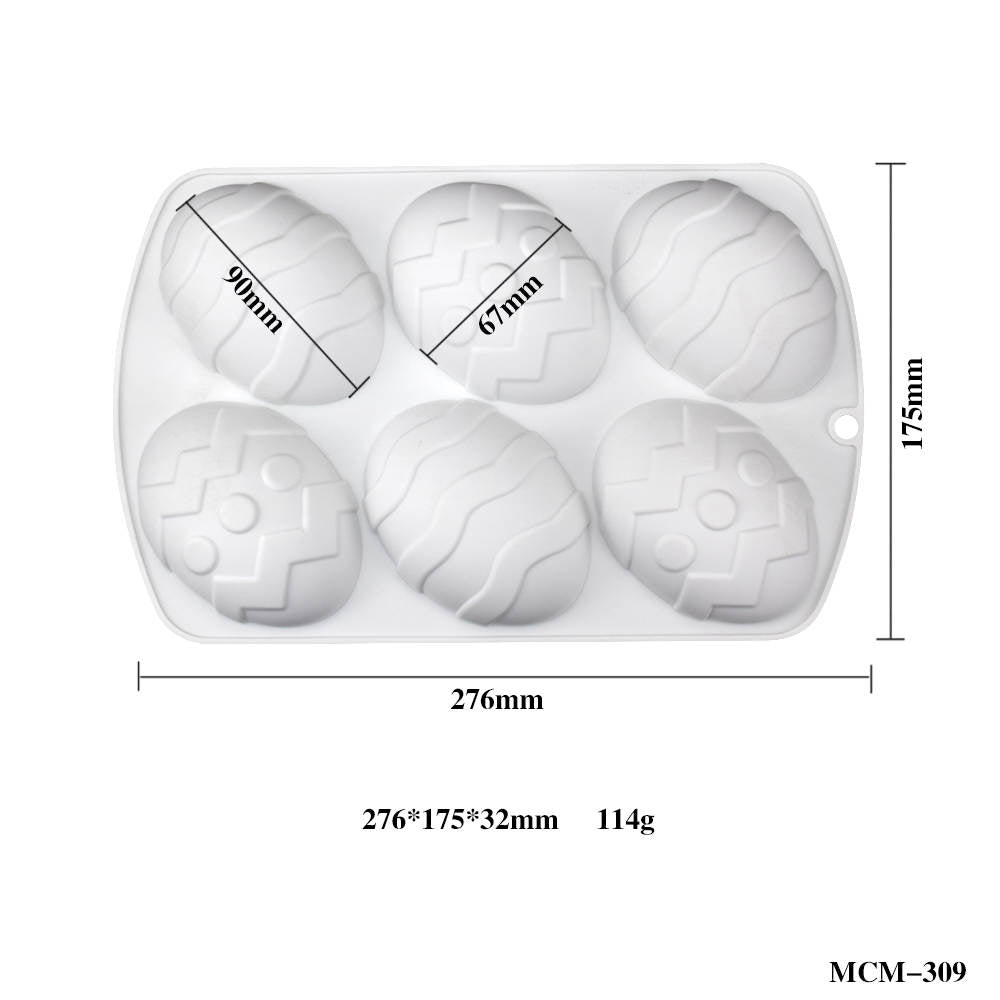 A white silicone mold designed for shaping eggs, featuring six oval cavities with various textured patterns. The mold dimensions are marked: 276mm in width and 175mm in height, with each egg-shaped cavity measuring 90mm and 67mm. The thickness of the mold is 32mm, and it weighs 114g.