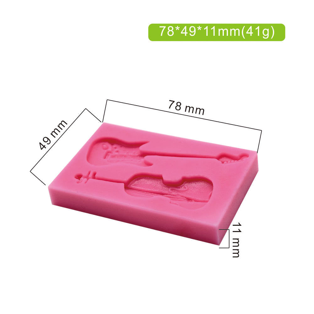 The image shows a pink silicone mold designed for creating shapes of a guitar and a violin. The mold features detailed impressions of both instruments. Dimensions are marked on the image: it measures 78 mm in length, 49 mm in width, and 11 mm in height, with a weight of 41 grams.