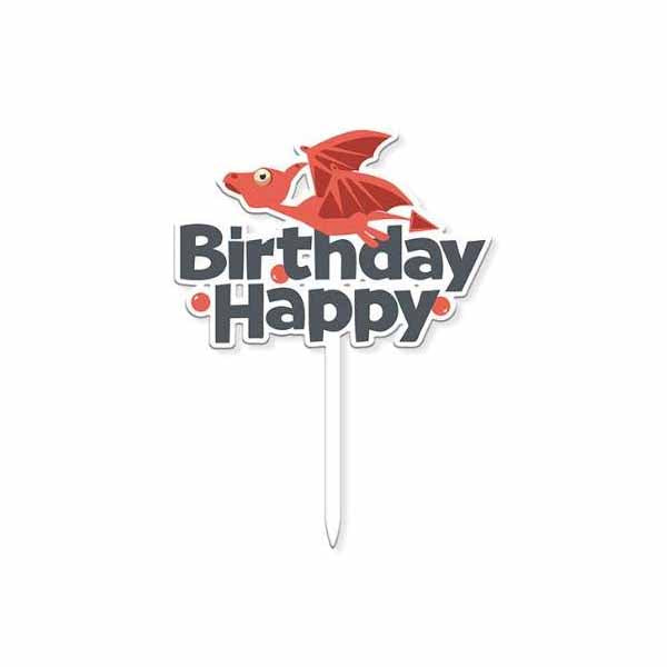 A colorful cake topper featuring the words "Happy Birthday" in bold letters. The word "Happy" is in black, and "Birthday" is in a playful red font. Above the text, there is an illustrated red dragon with wings outstretched. The whole topper is set on a white stick for insertion into a cake.