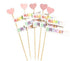 Image features a collection of birthday cake toppers. There are five decorative sticks, each topped with a pink heart or a flag that reads "HAPPY" and "BIRTHDAY" in colorful letters. The sticks are arranged together, presenting a festive and cheerful design suitable for birthday celebrations.