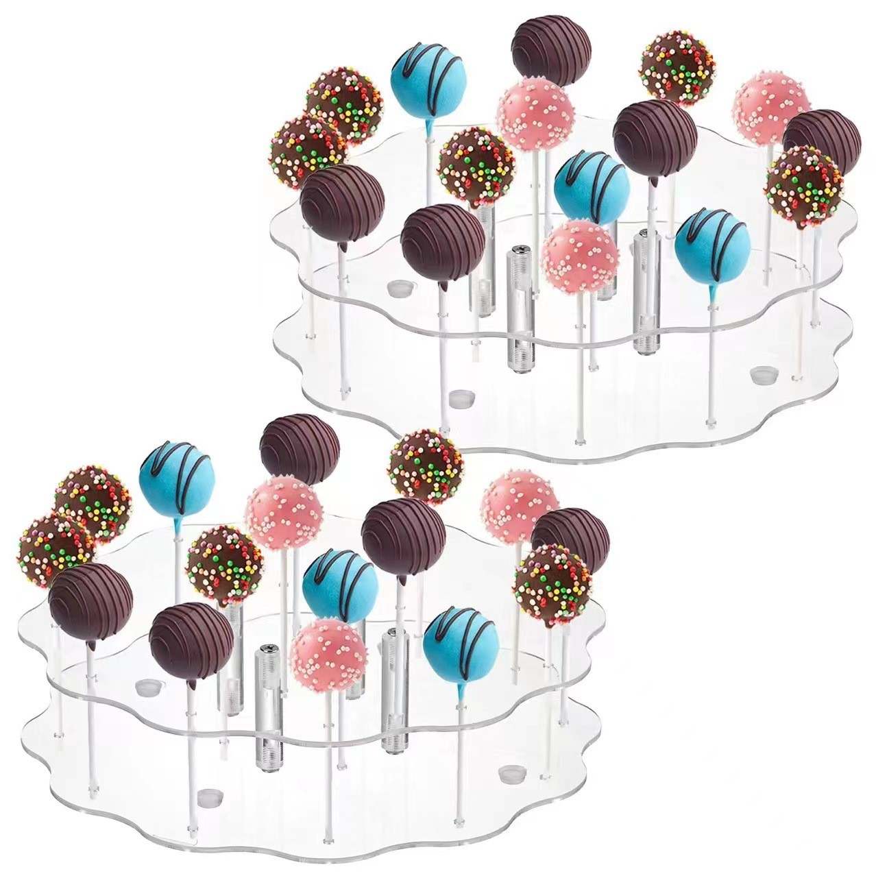 A transparent acrylic display stand featuring two tiers, each holding various colorful cake pops. The cake pops are topped with chocolate coatings, sprinkles, and different colors, including pink, blue, and brown. Each cake pop is presented on a stick and arranged in 15 holes across the two tiers of the stand.