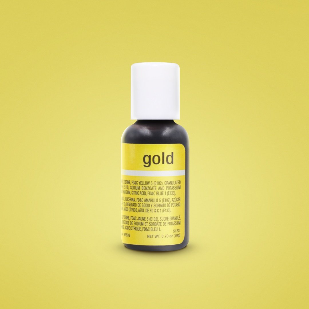 The image shows a small bottle of Chefmaster Liqua Gel Color in gold, with a white cap. The bottle is predominantly black with a yellow label stating "gold" and contains information about the product&