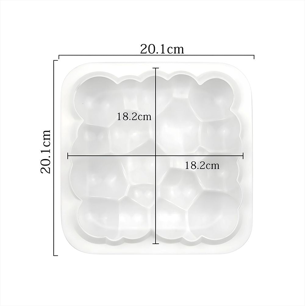A square tray featuring four assorted sizes of ice cream scoops in vibrant colors, artistically arranged.