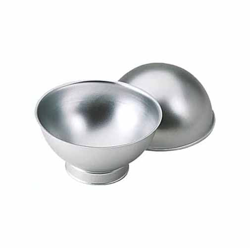 Two metal baking pans designed for making spherical cakes. One pan is a half-sphere shape with a smooth, reflective surface, while the other is a bowl-shaped pan that complements it. Both pans are silver in color and lack any visible handles or decorations.