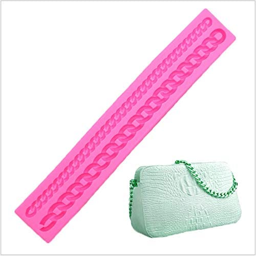 A long, pink silicone mold designed to create bag chains, featuring a chain link design. Next to the mold, there is a white handbag with a textured surface and a green chain strap.