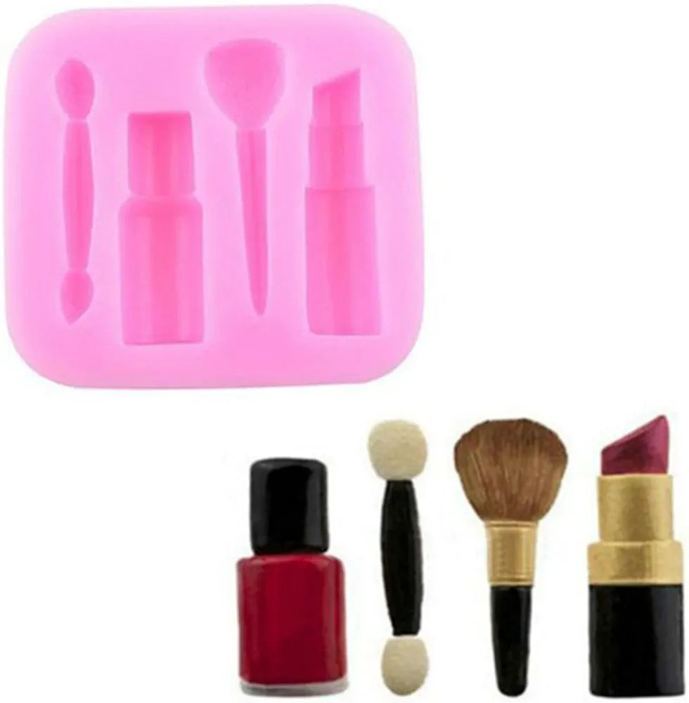 A bright pink silicone mold featuring four cavities shaped like various makeup tools: a small bottle, a brush, a lipstick tube, and a spatula-like tool. Next to the mold, there are several makeup items: a red nail polish bottle, a dual-ended makeup applicator, a brush, and a lipstick tube with a dark pink shade.