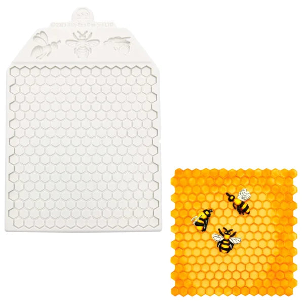 The image features a silicone mold shaped like a honeycomb. The mold is white and has a textured surface with a hexagonal pattern, mimicking the structure of actual honeycomb. Above the hexagons, there are embossed designs of bees. Beside the mold is a finished piece made from the mold, which is a bright orange color, also in a honeycomb shape, containing small decorative representations of bees in contrasting black and white colors.