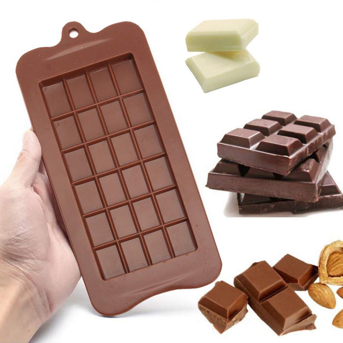 A hand holds a brown silicone mould designed to create chocolate bars, featuring a grid with rectangular sections. Surrounding the mould are various types of chocolate, including pieces of dark chocolate, white chocolate squares, and a few chocolate bars stacked together. Additionally, there are broken pieces of chocolate with almonds nearby.