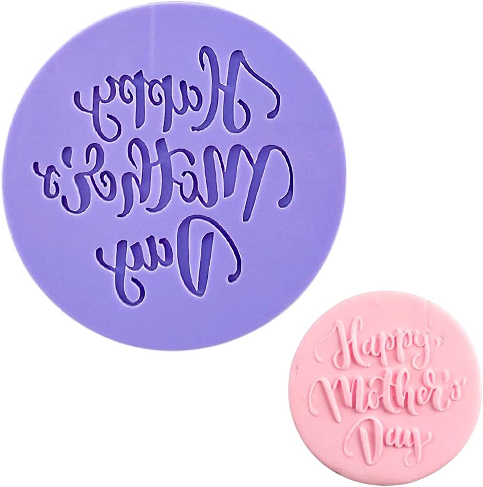 The image features a purple fondant embosser cookie stamp and a pink fondant piece. The embosser has an intricate design, textually stating "Happy Mother&