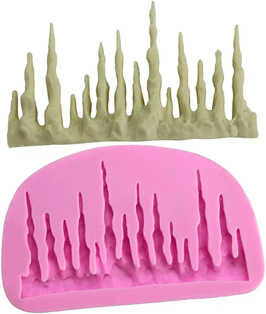 Two silicone moulds designed for creating frozen icicle shapes. The top mould is a light beige color and features several icicle designs of varying heights. The bottom mould is a vibrant pink and has a similar icicle pattern with defined details. Both moulds are shown side by side.