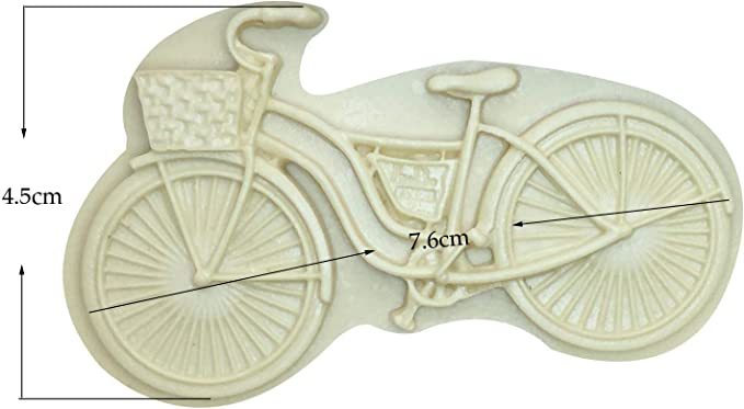 A silicone mould shaped like a vintage bicycle, featuring a front basket and detailed wheels. The mould measures approximately 7.6 cm in width and 4.5 cm in height. It has a light, neutral color.