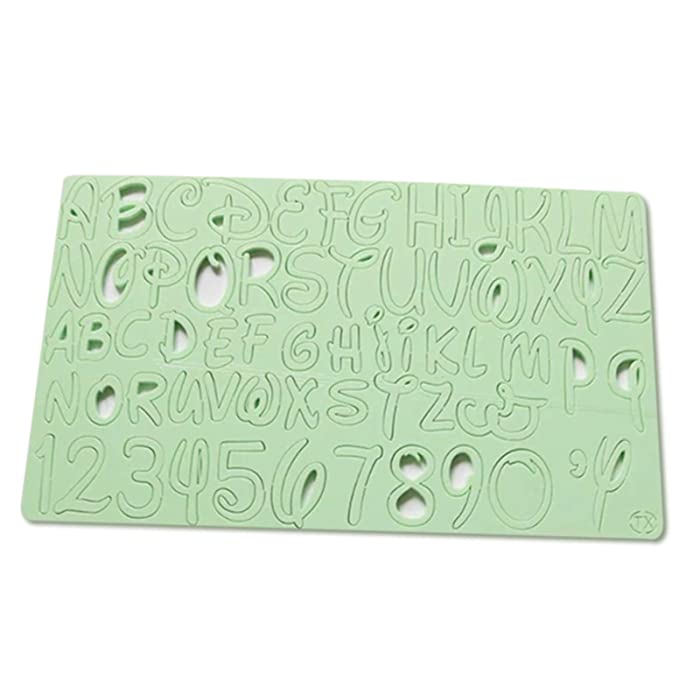 A light green acrylic stamp sheet featuring lowercase letters of the English alphabet, numbers 0 to 9, and a single comma and apostrophe. The letters are arranged in rows, with each character having a cut-out design, making them suitable for stamping.