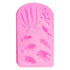 The image shows a pink silicone mould featuring various underwater-themed designs. The mould includes several fish shapes and marine elements such as seaweed and coral. The designs are raised, allowing for detailed impressions. The overall shape of the mould is rectangular with rounded edges.