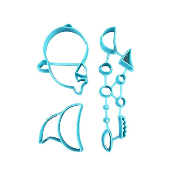 The image features a set of four blue plastic cookie cutters designed in the shapes associated with the "Baby Shark" theme. The shapes include:
1. A shark&