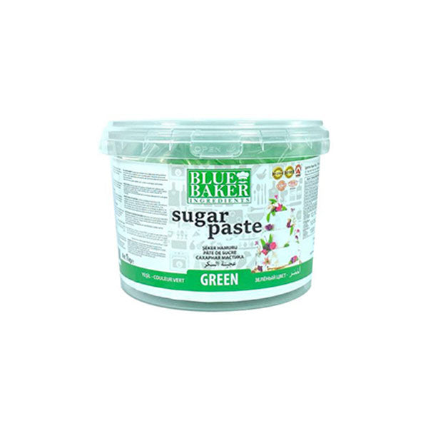 A round, clear plastic container of green sugar paste fondant labeled "Blue Baker." The container has a green and white design with the product name prominently displayed in black text. There are images of flowers and a decorated cake on the front. Additionally, the label includes various icons and text related to product information and usage. The container has a lid and is positioned on a plain white background.