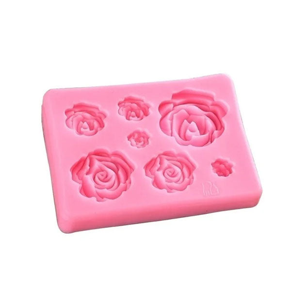 An image of a pink silicone mould featuring several rose flower shapes. The mould contains five different sized rose designs, perfect for creating decorative flowers. The overall shape of the mould is rectangular with a smooth surface, highlighting the intricate details of the roses.
