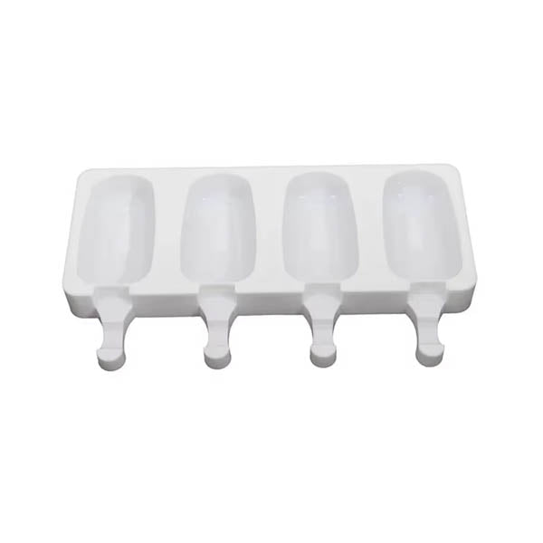 The image shows a white silicone ice cream mold designed with four cavities. Each cavity has a rounded shape, resembling a popsicle, with a handle at the bottom for easy removal. The mold is flat and rectangular, with the cavities arranged side by side, allowing for the creation of four ice cream or cakesickle treats at once. The overall design is simple and functional, suitable for making frozen desserts.