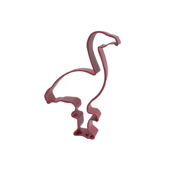 A flamingo-shaped cookie cutter in a vibrant pink color, depicting the bird standing with its neck curved and one leg raised. The cutter features defined outlines to create the shape of a flamingo. The background is plain white.