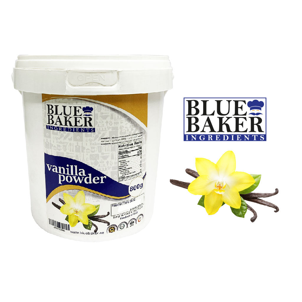 An 800g white container of "Blue Baker Vanilla Powder" is displayed. The front label features the product name, nutritional information, and a yellow flower with green leaves, representing vanilla. To the right, the "Blue Baker" logo is visible, which includes the brand name in bold letters and a chef&