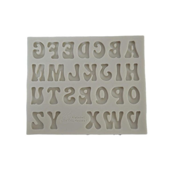 A silicone mold featuring uppercase alphabet letters in a groovy style. The letters A to Z are arranged in multiple rows, all displayed in a playful, rounded font. The mold is light-colored, making the letters easily visible within the indentations.