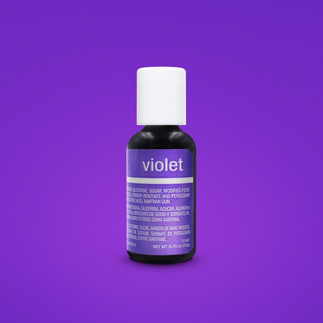 A bottle of Chefmaster Liqua Gel Color in violet, 0.7 oz (20 ml). The bottle is round with a white cap and a black base. The front label features the word "violet" prominently. The back label lists ingredients including glycerin, sugar, and food color additives, along with the net weight at the bottom. The background is a solid purple color.