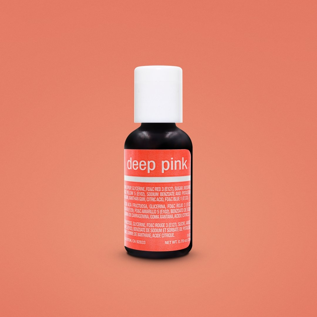 The image features a small bottle of Chefmaster Liqua Gel color in "Deep Pink." The bottle is predominantly black with a white cap. The label prominently displays the text "deep pink," along with other text detailing the ingredients and product information in both English and Spanish. The bottle is set against a soft, orange background. The net weight of the product is 0.7 oz (20 ml).