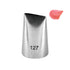 A metal piping nozzle labeled "127" with a tapered design, positioned next to a small dollop of pink icing. The nozzle has a slightly open tip to allow for decorating with frosting.
