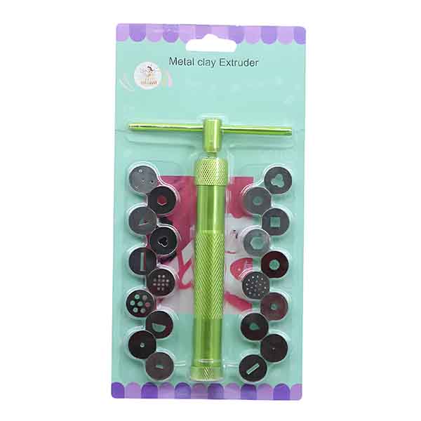 A green metal clay extruder displayed on a light green packaging card. The extruder has a handle and a cylindrical body with a textured grip. Surrounding the extruder are multiple circular disc attachments of various shapes and patterns, including solid circles, square, and dotted designs. The top of the packaging features the text "Metal clay Extruder."