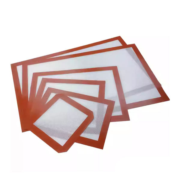A set of non-stick silicone baking mats in various sizes, featuring a white center with a textured surface and bordered by orange-red silicone edges. The mats are arranged in a staggered layout, showcasing their different dimensions.