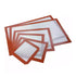 A set of non-stick silicone baking mats in various sizes, featuring a white center with a textured surface and bordered by orange-red silicone edges. The mats are arranged in a staggered layout, showcasing their different dimensions.