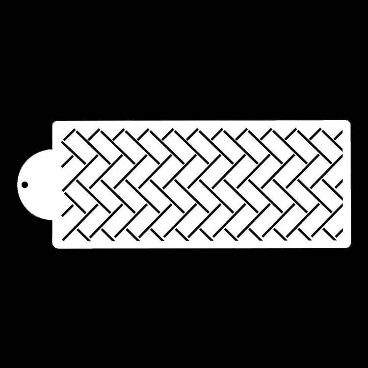 A white cake stencil featuring a repeating herringbone pattern. The stencil has a round handle on the left side, and the design consists of numerous angled lines arranged in a zigzag formation across the rectangular shape. The background is black.