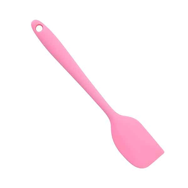 A pink silicone spatula with a flat, wide head and a long handle, featuring a hole for hanging. The spatula is presented on a white background.