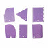 A set of six plastic scrapers in various shapes and sizes, all in a light purple color. The shapes include a zigzag-edged scraper, a triangular scraper, a rectangular scraper with both straight and serrated edges, a round-edged scraper, and two additional scrapers, one with a serrated edge. Each scraper has a small hole at one end for easy handling or hanging.