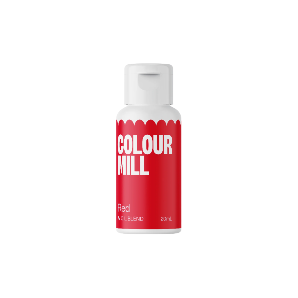 Image of a bottle labeled "Colour Mill" with a bright red background. The bottle contains red oil-based food color and is marked with the text "Red" and "20mL." The design features a white cap and decorative white scalloped edges at the top of the label.