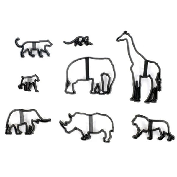 A flat lay image featuring a set of eight cookie cutters shaped like safari animals. The cutters include a giraffe, a rhinoceros, an elephant, a bear, a lion, a monkey, a cat, and a small lizard. Each cutter is made of black plastic and has cut-out shapes representing the outlines of each animal, with some having additional support bars for stability. The arrangement showcases the variety of animal shapes available in the set.