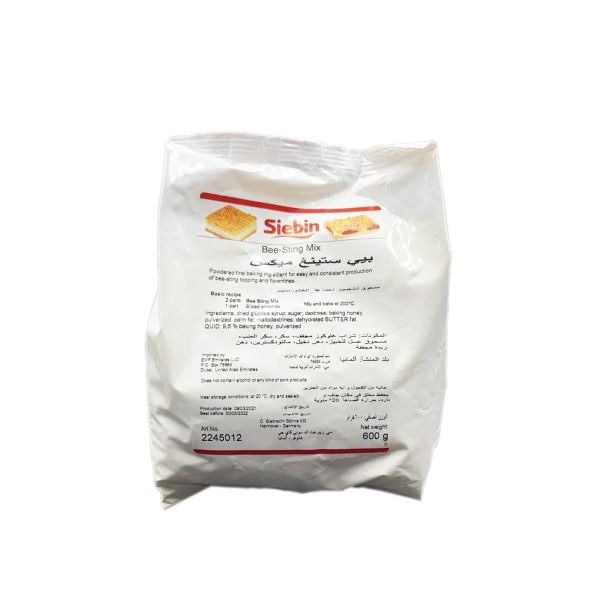 A white packaging bag labeled "Siebin Bee Sting Mix" with a net weight of 600 grams. The front features the product name in both English and Arabic, along with a small image of a dessert. The back contains ingredient information, preparation instructions, and storage recommendations. The bottom right corner includes a product code and net weight details.