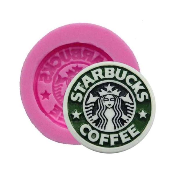 A pink silicone mold shaped like the Starbucks logo is displayed alongside a finished product featuring the same logo. The mold has a circular design with the word "Starbucks" and decorative elements around it, while the finished product is in green and white, showcasing the mermaid and "COFFEE" text prominently.