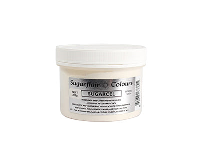 The image shows a plastic container of Sugarflair Sugarcel Tylose Powder, with a white lid. The container is labeled with the brand name "Sugarflair" and the product name "SUGARCEL," along with relevant information about the contents. The jar is white with a clear label displaying the product details, specifically indicating a net weight of 14 grams.