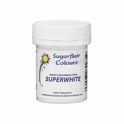 The image shows a round white container of Sugarflair Superwhite icing whitener, weighing 20 grams. The container has a screw-top lid and features a colorful label with the brand name "Sugarflair Colours," along with the product name "Superwhite." The label also indicates that it is "newly reformulated." A sun symbol is present on the label, and details about the manufacturer are listed on the side. The overall design conveys a clean and baking-focused aesthetic.