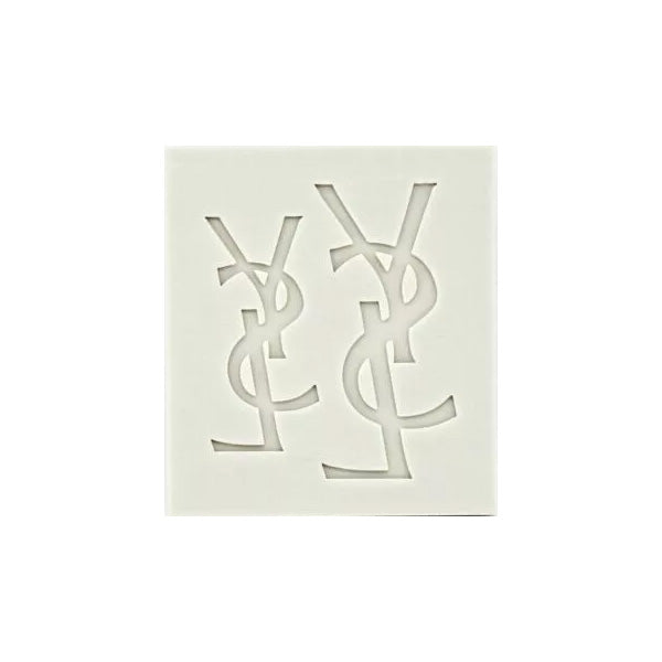 A silicone mold featuring the intertwined letters "YSL" in a minimalist design. The mold is light-colored and has a rectangular shape, showcasing two sets of the logo in a cut-out style.