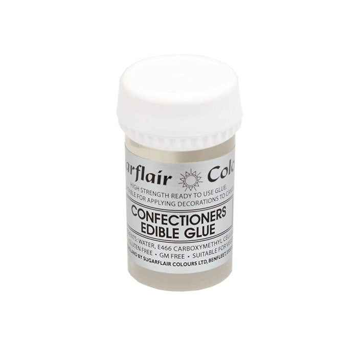 An image of a 40g container of Sugarflair Confectioners Edible Glue. The container features a white screw-cap lid and a label that includes the product name and usage instructions. The label indicates that it is a high-strength, ready-to-use glue suitable for applying decorations to cakes and is free from GM ingredients. The ingredients listed include water and carboxymethyl cellulose. The product is manufactured by Sugarflair Colours Ltd.