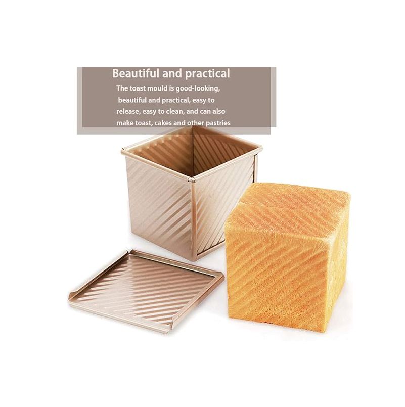 Square bread mold with a loaf of bread on a white background