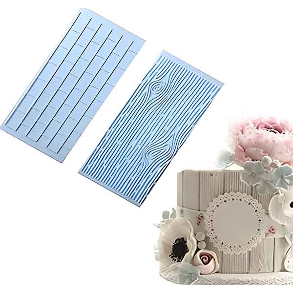 The image features two silicone impression molds designed for crafting. One mold is shaped to simulate a brick wall texture, featuring rectangular patterns resembling bricks. The other mold mimics the appearance of tree bark, with wavy, elongated lines that create an organic wood-like impression. In the background, there is a decorative box or cake covered in a white wooden panel design, adorned with flowers and a round doily, showcasing how the molds can be used for artistic purposes.