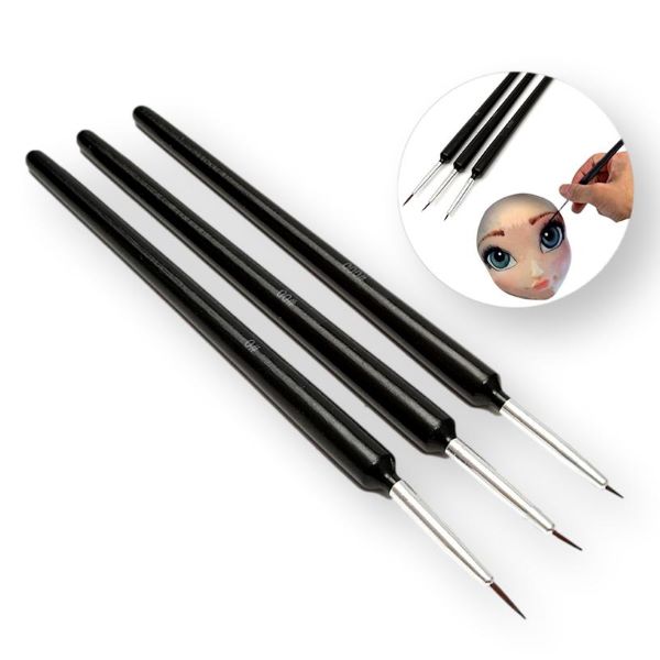 "Three thin decorating brushes with black handles and fine tips, arranged horizontally. An inset image shows a hand using one of the brushes to paint a detailed design on a doll&