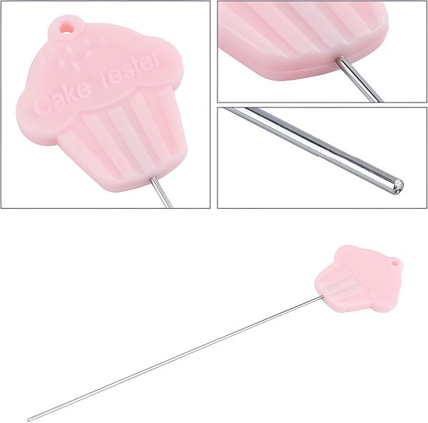 A stainless steel cake tester needle featuring a pink cupcake-shaped handle. The handle is embossed with the words "Cake Tester" and has ridges resembling a cupcake wrapper. The long metal needle extends from the handle, designed for testing the doneness of baked goods.