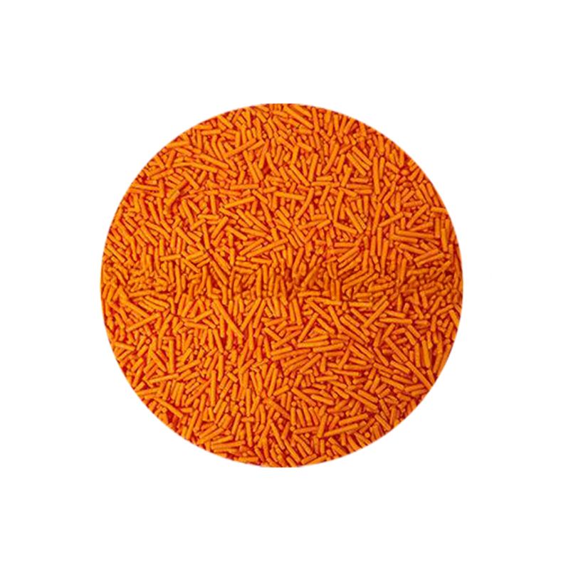 Bright orange sprinkles fill a circular frame, creating a vibrant and playful pattern against a white background. The tone is cheerful and lively.