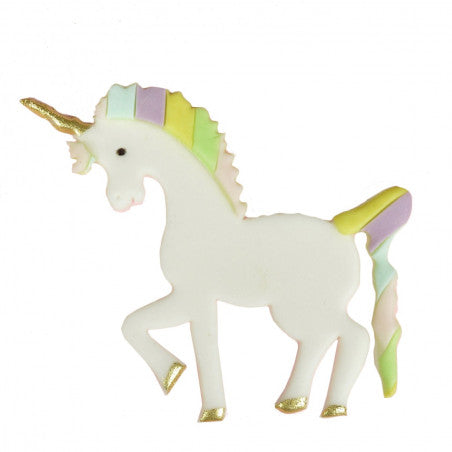 A decorated cookie shaped like a unicorn. The unicorn is predominantly white with a colorful mane featuring pastel shades of pink, yellow, and green. It has a gold horn and golden accents on its hooves. The unicorn is posed in a playful stance.