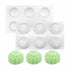 An image featuring two silicone moulds designed in the shape of chrysanthemum flowers, each with six cavities. The moulds are white and show intricate floral details. In front of the moulds, there are three finished products in a light green color resembling the chrysanthemum flower shape, demonstrating the mould&
